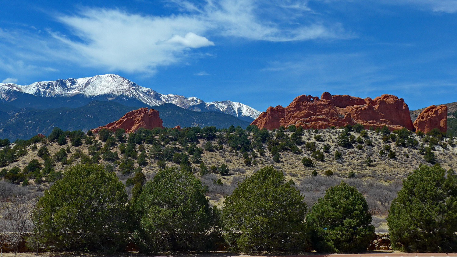 Red rocks in the Garden of the Gods with 4300 meters high Pikes Peak